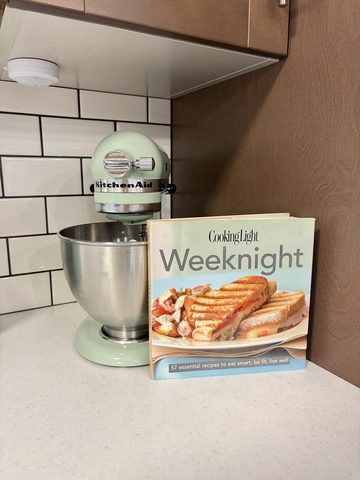 Feel like baking? A KitchenAid mixer with three separate attachments is ready.