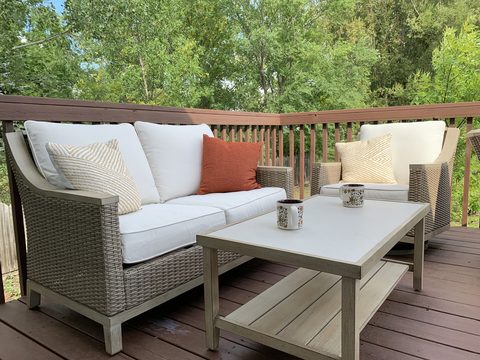 Settle in on a private deck that looks out over mature trees