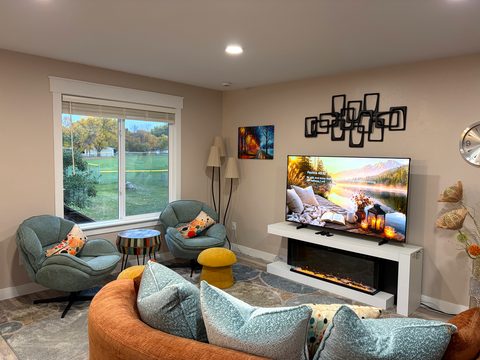 Movie night upstairs: a 65-inch TV over an electric fireplace
