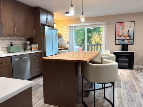 Pull up a stool at the island, with a fully stocked kitchen right behind you
