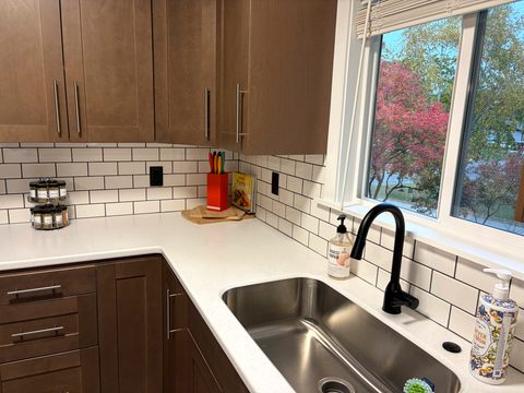 Even the dishes come with a view of the trees outside the sink window