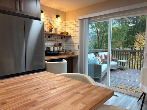 Kitchen, coffee bar and deck are steps apart, so the whole morning flows