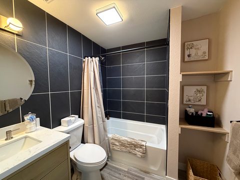 A tub and shower downstairs, so nobody has to climb the stairs to freshen up