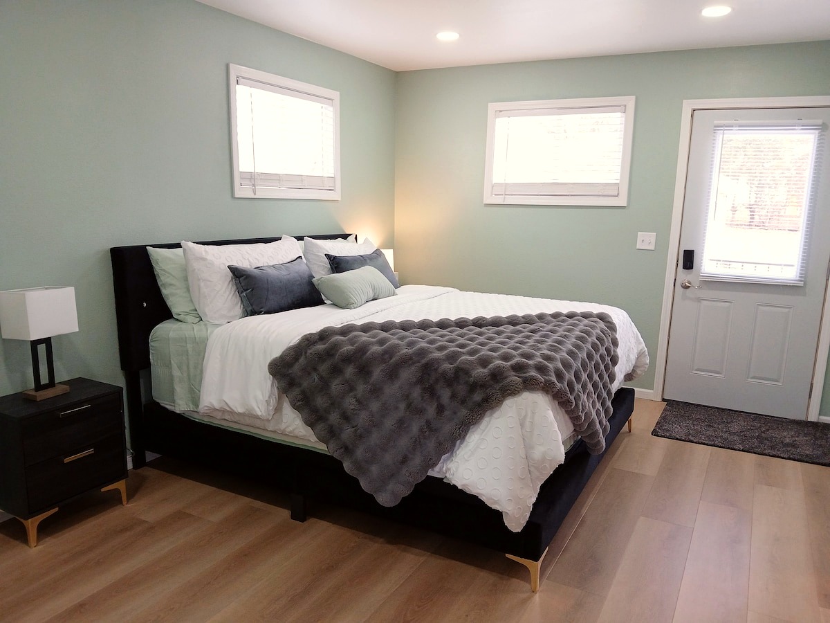 King bedroom, modern styling, Pretty in Pink Bismarck short-term rental
