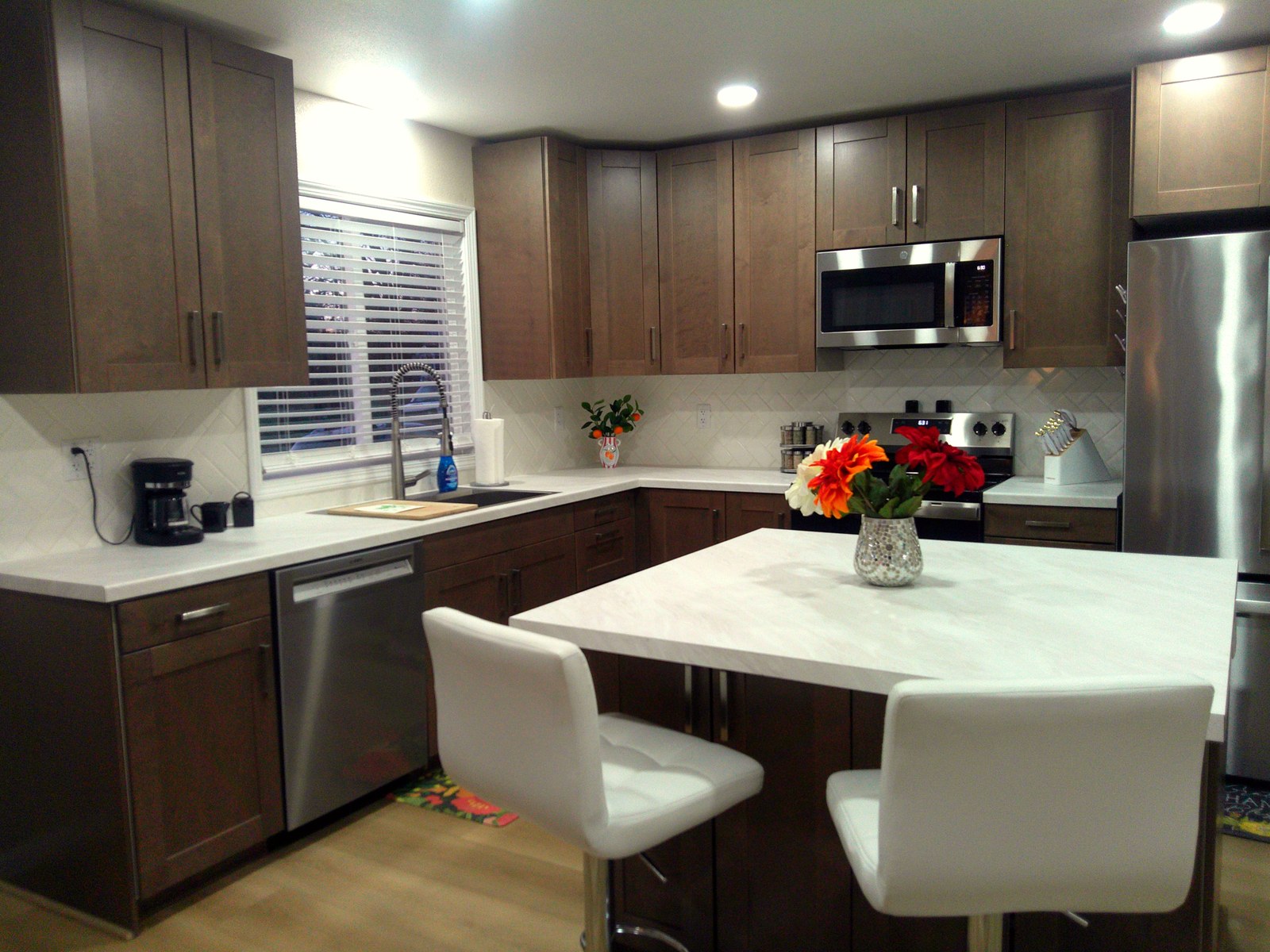 Bright, fully stocked kitchen in this Bismarck short-term rental