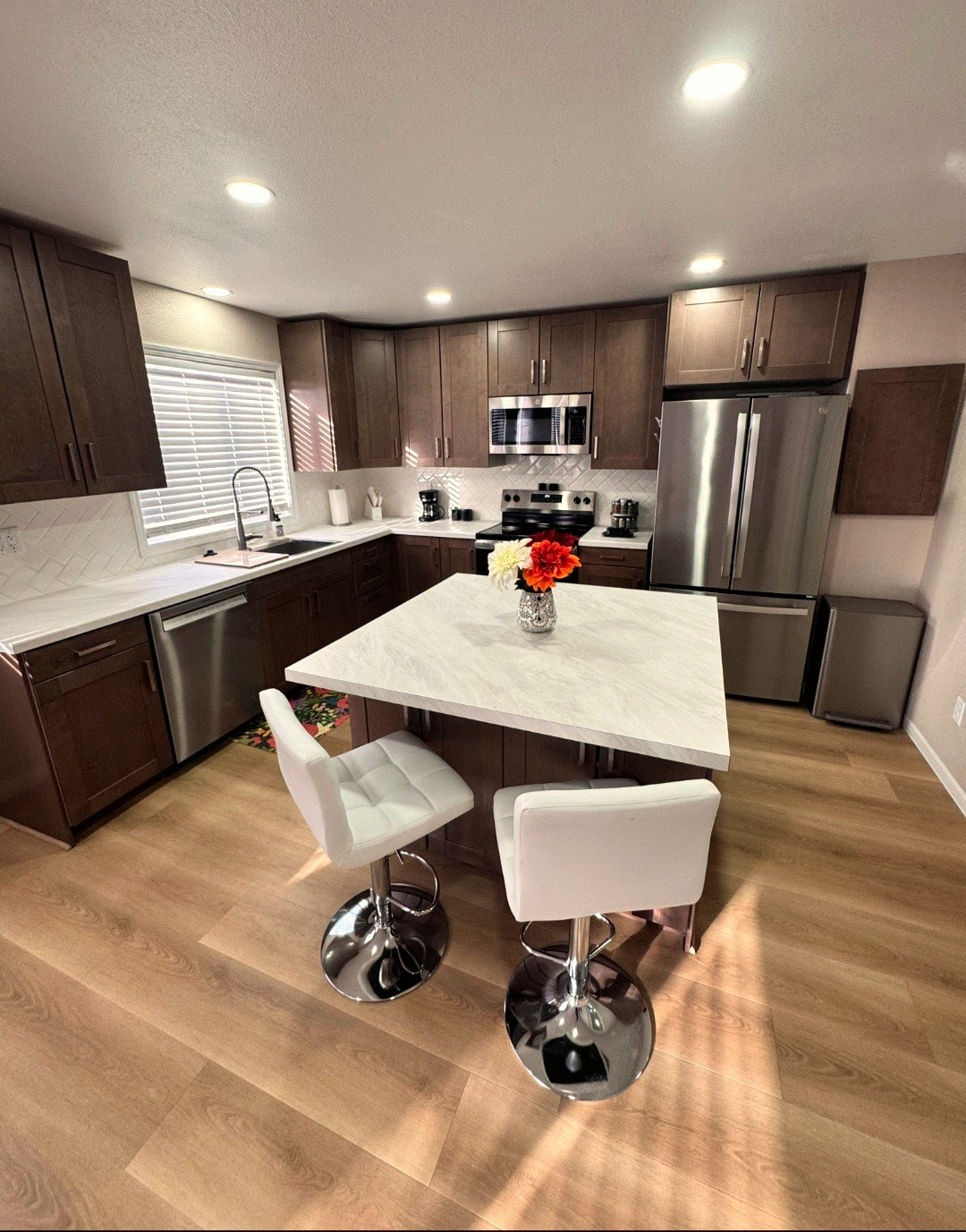 Fully stocked kitchen island with natural light, Bismarck short-term rental