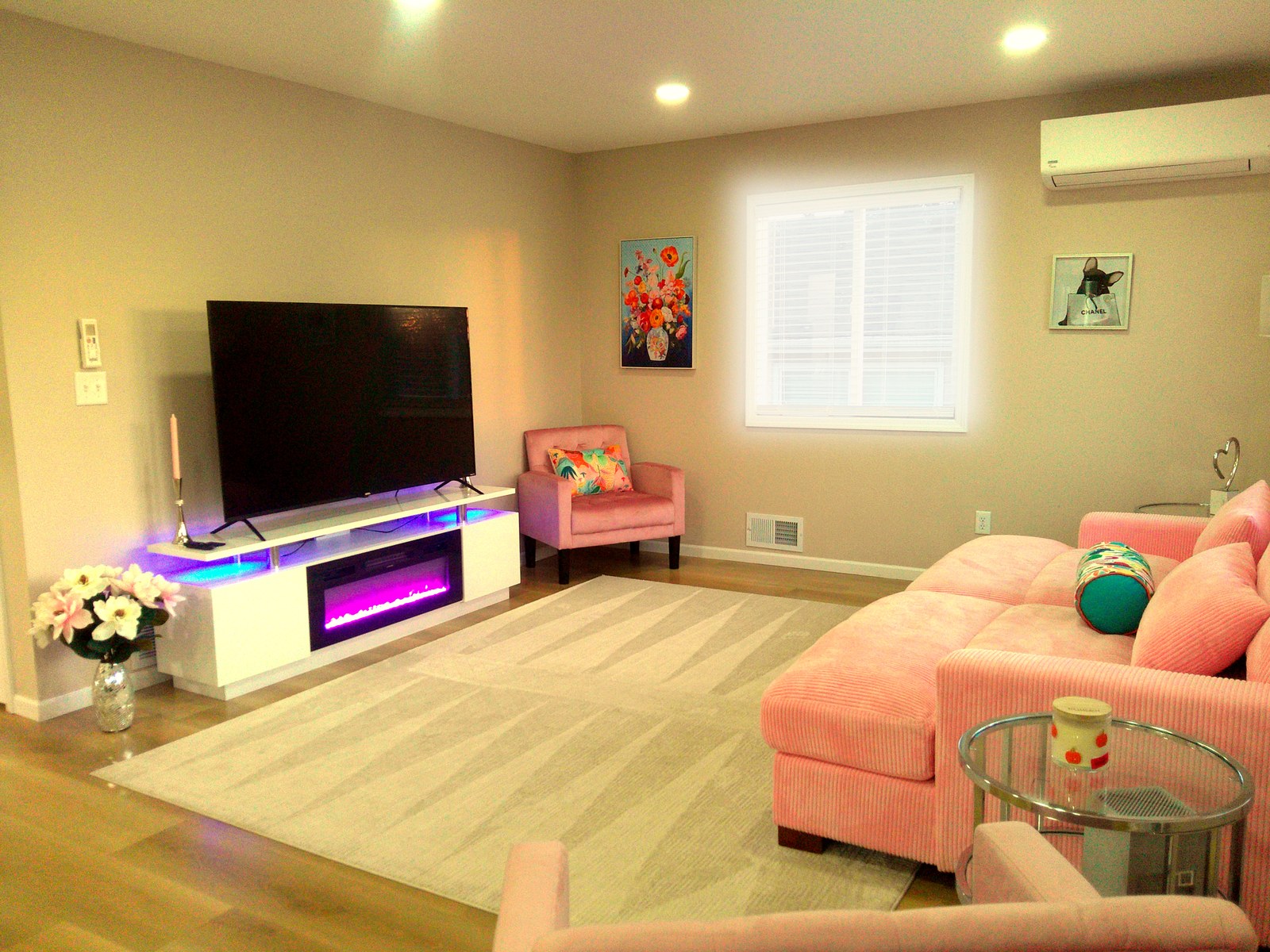 Bright short-term rental living room in Bismarck with pink sofa and warm afternoon light