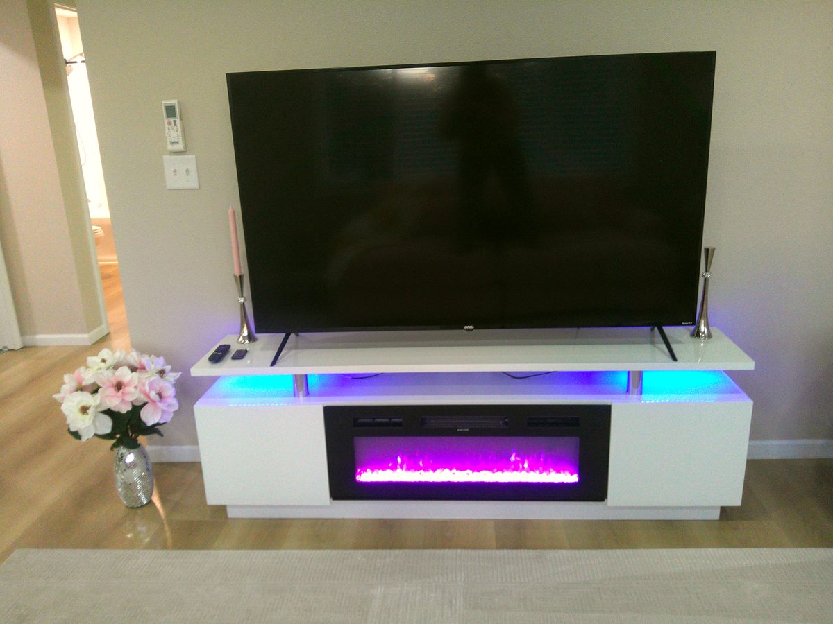Living room TV and fireplace feature wall